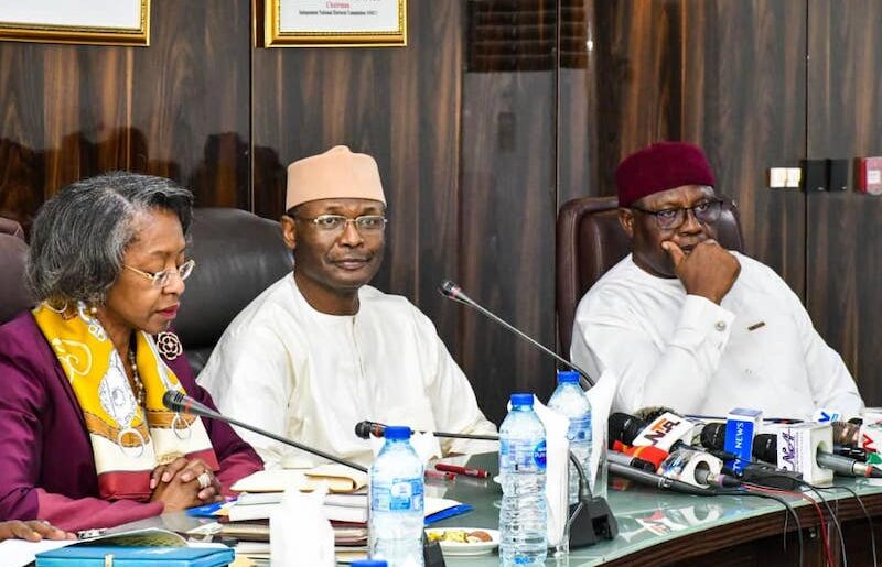 INEC chairman Yakubu, middle, and other officials of the agency