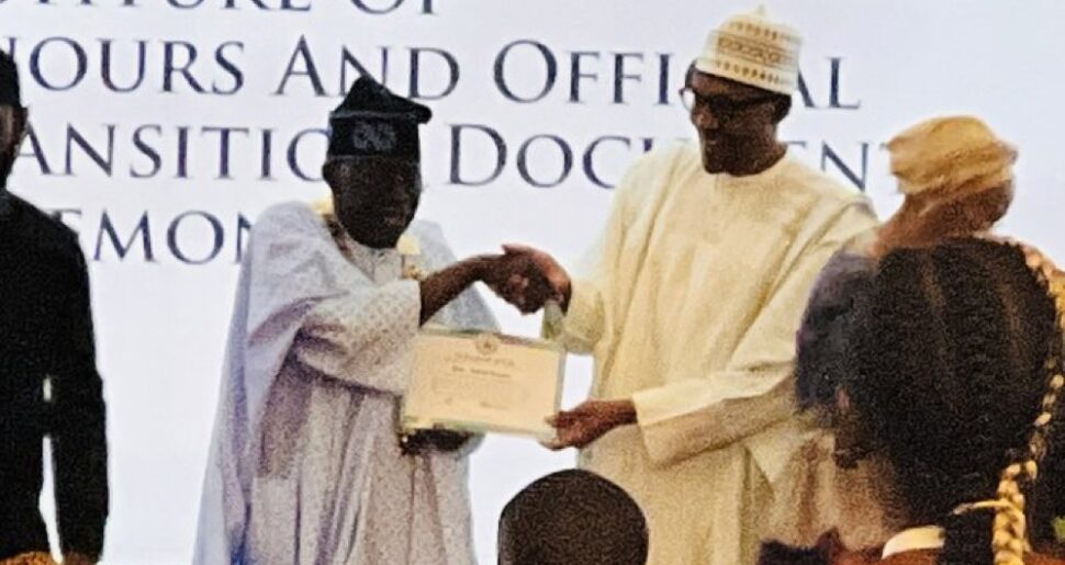 Tinubu receives from President Buhari the certificate of GCFR